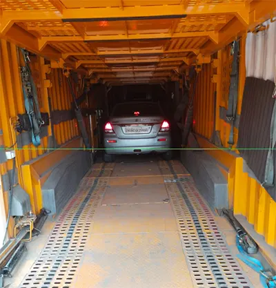Secure car transport service showing safe loading in 